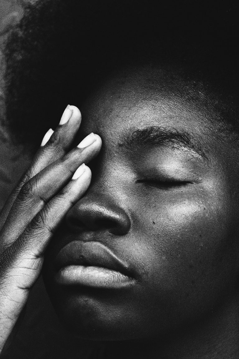 An African American woman touches her eye with an uncomfortable look on their face. This could represent the discomfort of anxiety symptoms. Contact an anxiety therapist in Pasadena, CA for more info about anxiety treatment in Sacramento, CA. 91101 | 95814 | 95688 | 95765