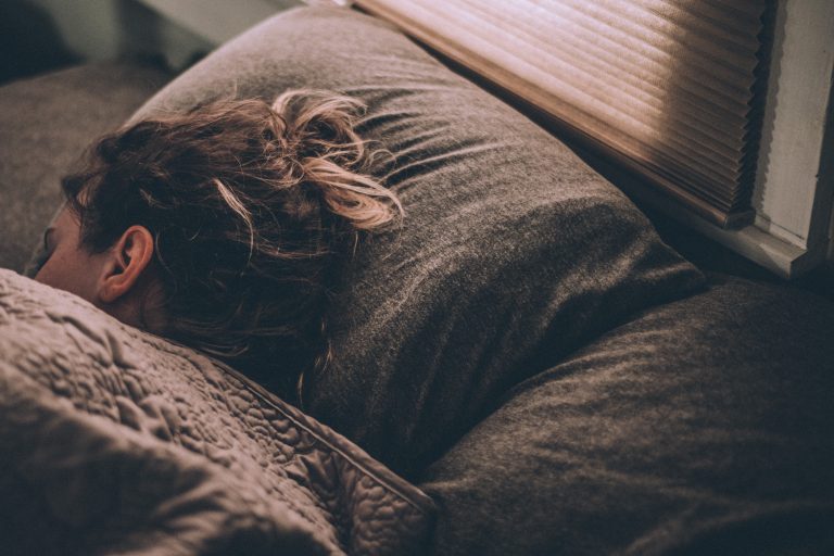 A woman sleeps with her head on a pillow. A depression therapist in Pasadena, CA can help you overcome depression and regain your energy. Learn more about depression treatment in Sacramento, CA and more. 95814 | 95688 | 95765