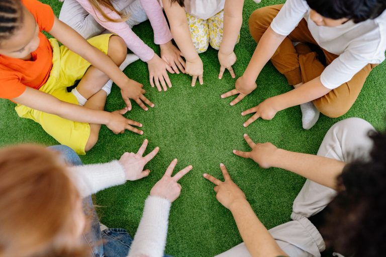A group of children sitting in a circle. As part of our child therapy in Pasadena offerings, group therapy is a powerful healing modality. 91101