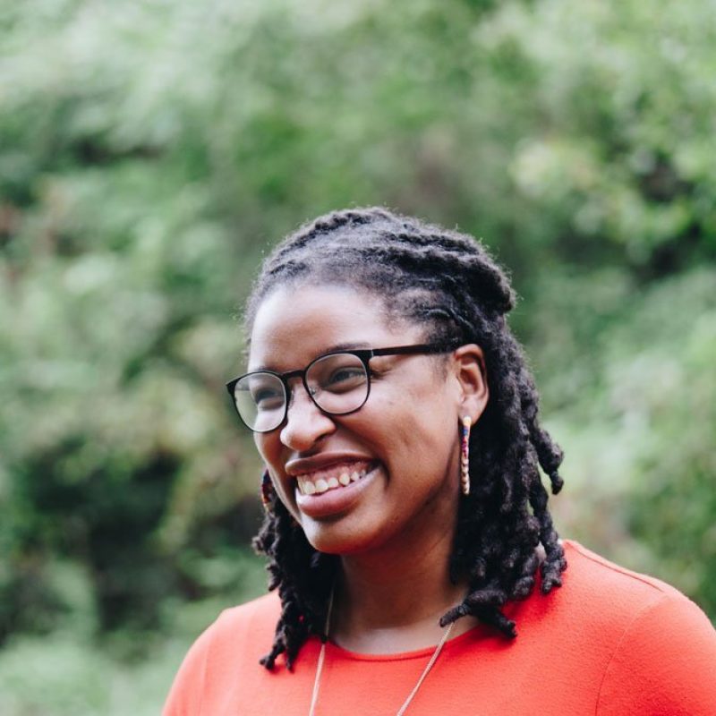 smiling | individual therapy in pasadena, ca | individual therapy near me | individual therapist in pasadena, ca | 90065 A happy woman smiles brightly in front of lush foliage. This could represent the benefits of individual therapy in Pasadena, CA. Contact an individual therapist for support with individual therapy for depression and other services.