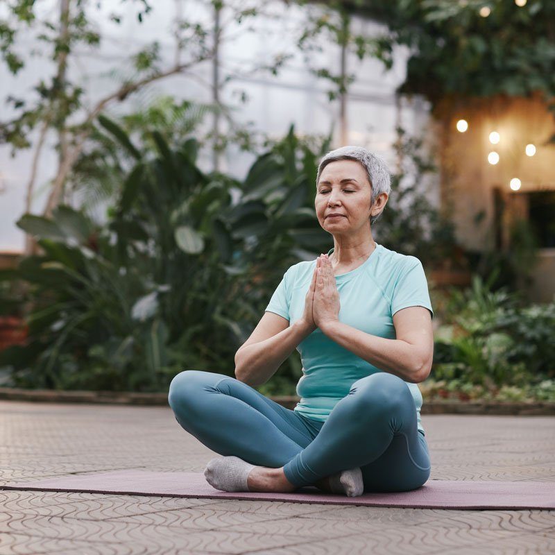 woman meditating | anxiety treatment in pasadena, ca | somatic therapy in pasadena, ca | anxiety treatment in sacramento, ca | 91101 | 95814 | 95688 | 95765 A woman sits on a matt while meditating. This could symbolize how mindfulness can help treat anxiety symptoms. Contact an anxiety therapist for info on anxiety treatment in Sacramento, CA. We would be happy to provide panic attack treatment and other services to support you! 91101 | 95814 | 95688 | 95765